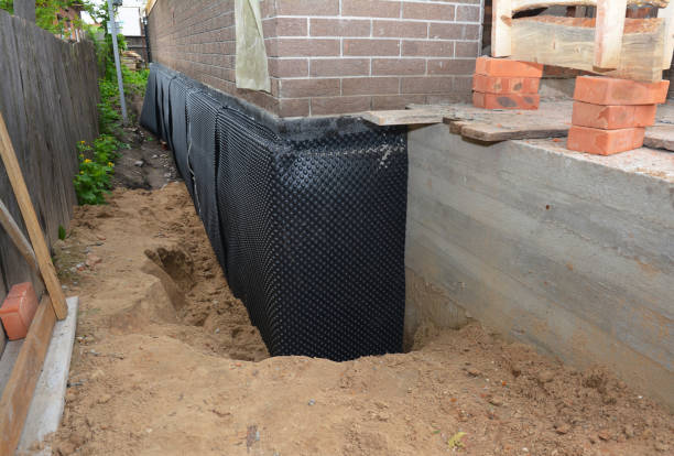 Happy homeowners after waterproofing job in Glencoe